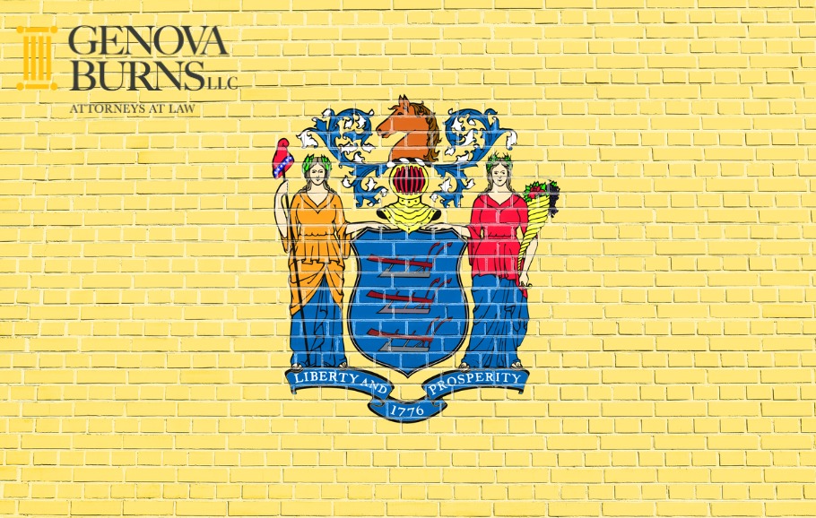 The State flag of New Jersey painted on a yellow brick wall