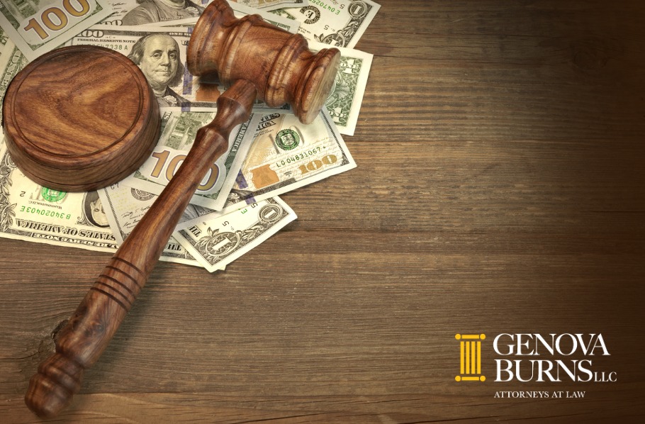 Gavel and money on wooden table